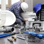 Professional plumber fixing bathroom pipe with tools, ensuring reliable solutions and smooth renovation process.